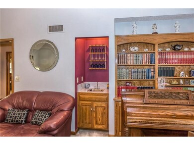 WET BAR & BUILT IN BOOK CASE WITH CABINETS UNDERNE