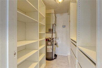 Large walk in closet with built ins in master bedr