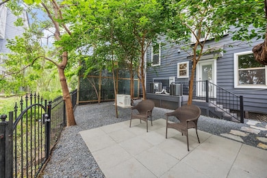 Large backyard has mature trees with natural shade