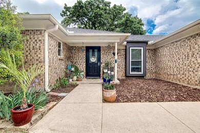 Property entrance featuring brick siding