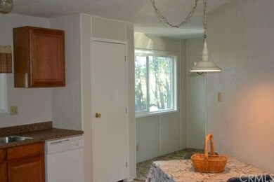 Kitchen has dining nook and pantry