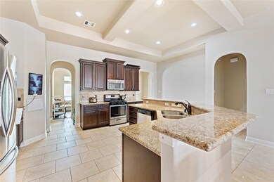 Kitchen w/ island, granite counter tops, and stainless steel appliances