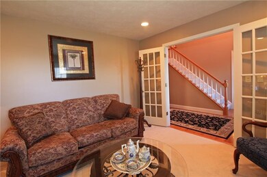 French doors welcome you into this cozy formal liv