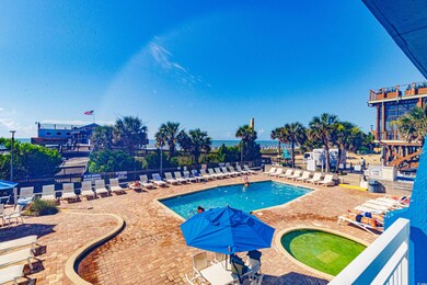 Community pool with a patio and a community hot tub