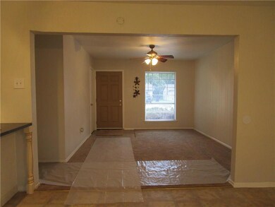Living room view toward front door entry from the 