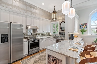 Kitchen - granite countertops, ss appliances, and island