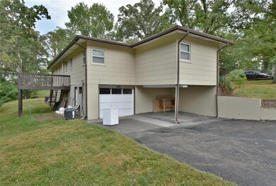 Garage for 1805 B includes a carport and 18x11 sin