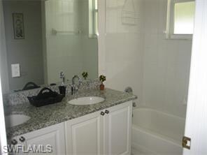 Guest Bathroom with Dual Sinks and Granite Counters