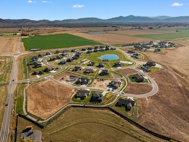 Birds eye view of property with a mountain view an