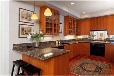 Gourmet kitchen with breakfast bar, wine fridge an