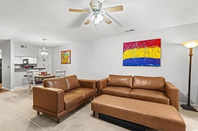 Living room featuring a textured ceiling, ceiling 