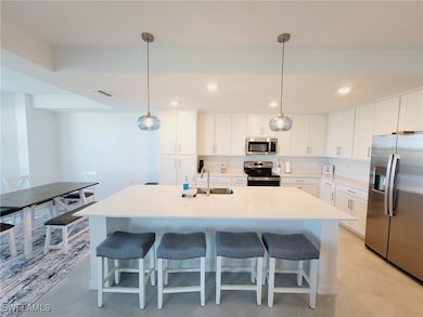 Kitchen with appliances with stainless steel finis