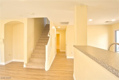 Stairs featuring wood finished floors, visible ven