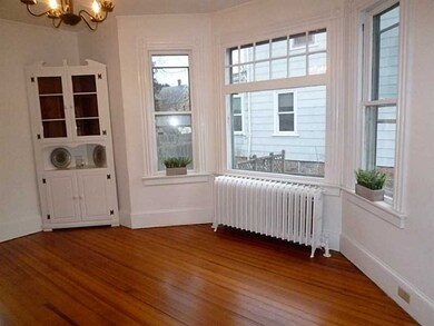 Dining Room. Sunlit dining room with bay window.