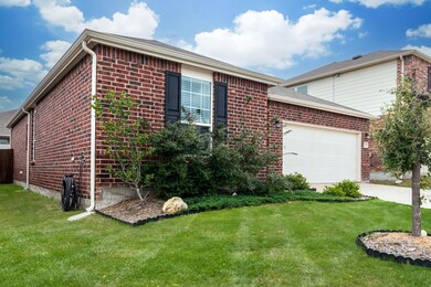View of front facade featuring a garage and a fron