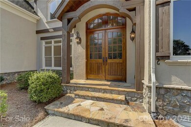 Custom, dual front doors w/glass panels