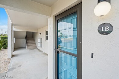 Property entrance featuring stucco siding