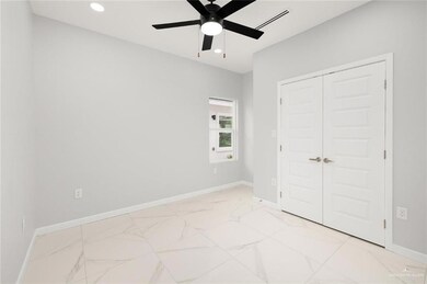 Unfurnished bedroom featuring a closet and ceiling fan
