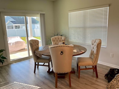 Dining area featuring wood-type flooring