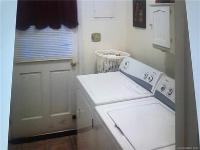 Laundry Room with Door to Back of Property