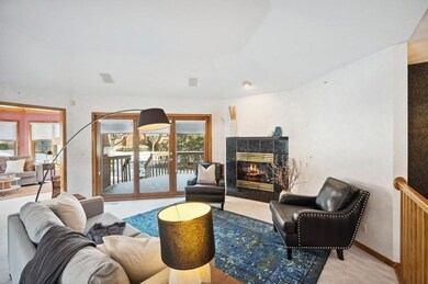 You'll be drawn to the warmth of the fireplace, inviting you to unwind.