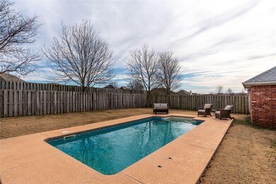 Large backyard with wood privacy fence and vinyl-l