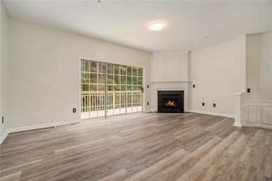 Unfurnished living room with light wood-style flooring and a fireplace