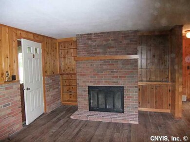 Living Room. w/ wood burning fireplace.