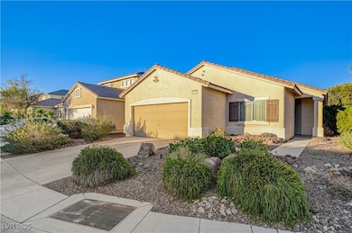 View of front of home featuring a garage, stucco s