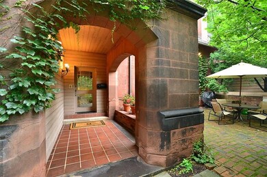 The graceful front entry also shows the adjacent p