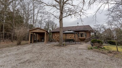 Front w/ deck and carport