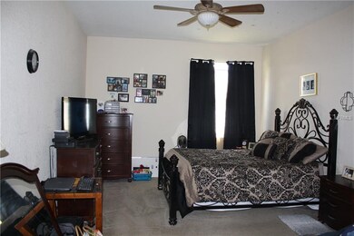 Large master bedroom easily accommodates a king size bed