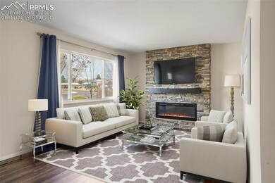 Virtually staged Living area featuring baseboards,
