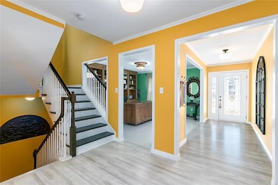 Beautiful Entry Foyer with Hardwood Flooring and a