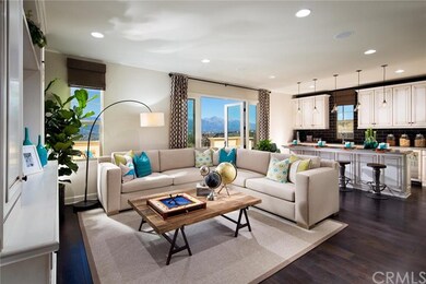 Open floor plan with high vaulted ceilings and rec