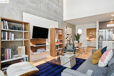 Living room featuring wood finished floors and a towering ceiling