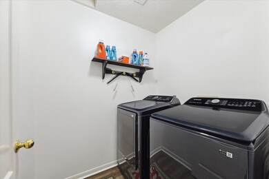 The utility room is located right off the kitchen.