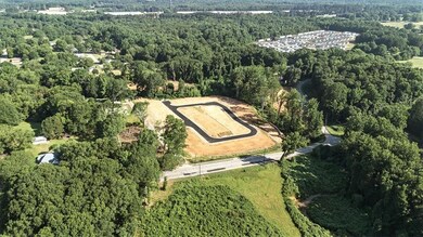 Aerial overview of property's location featuring a forest