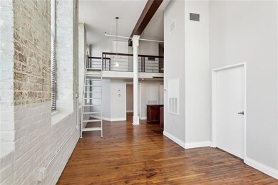 The stairs lead to the third bedroom. The open doo