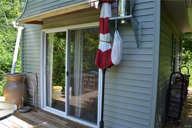 Rain barrel stays with property.  Entrance to cabi
