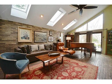Living Room. Bright Vaulted Ceiling and Hardwood F
