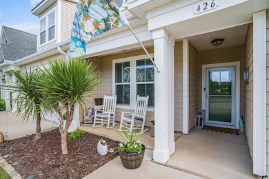 Doorway to property featuring a porch
