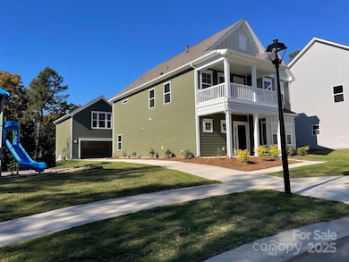 2 car rear detached garage has a finished bonus, wetbar and full bath