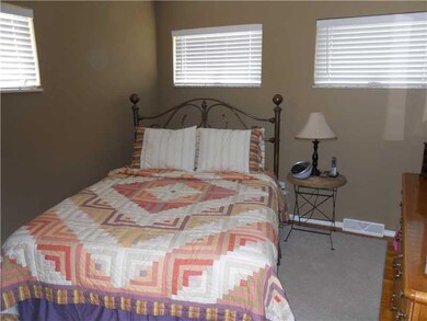 Master Bedroom. Pretty custom blinds at the window