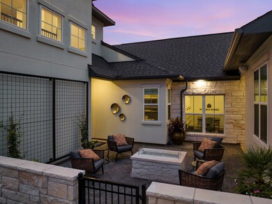 View of patio with an outdoor fire pit