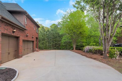 View of patio / terrace featuring driveway and a g
