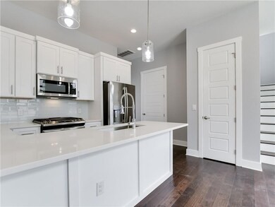 Kitchen with recessed lighting, stainless steel a