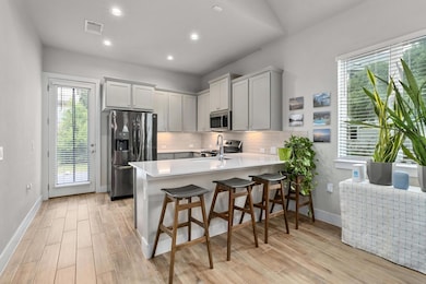 Kitchen featuring appliances with stainless steel