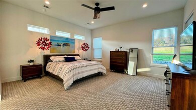 Bedroom featuring carpet floors, baseboards, rece