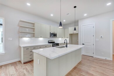 The kitchen provides ample storage space and count